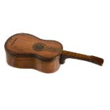 A stained and decorated olive wood box in the form of a guitar  A stained and decorated olive wood