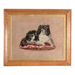 A framed and glazed tapestry picture of Queen Victoria  A framed and glazed tapestry picture of