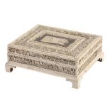 A George III carved bone faced counter box, circa 1800, of rectangular form  A George III carved