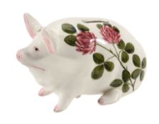 A Wemyss Bovey Tracey piglet money box, circa 1930 , painted with red clover  A Wemyss Bovey