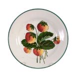 A small Wemyss plate, circa 1900, painted with strawberries, impressed 'WEMYSS'  A small Wemyss