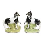 A pair of Staffordshire pottery models of piebald horses, mid 19th century  A pair of