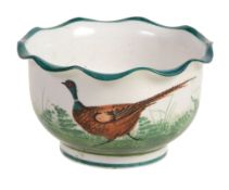 A small Wemyss bowl, circa 1900, painted with a running pheasant, wavy rim  A small Wemyss bowl,