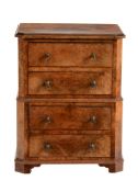 A miniature walnut chest on chest in George III style  A miniature walnut chest on chest in George
