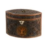 A George III paperscroll decorated pine tea caddy, late 18th cntury  A George III paperscroll