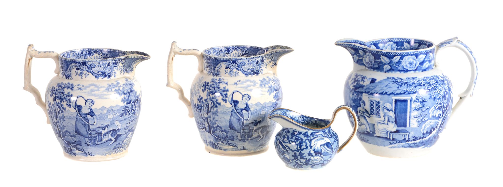 Four various British blue and printed pottery jugs, first quarter 19th century  Four various British