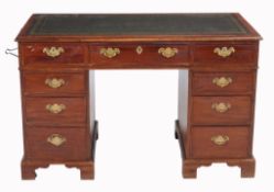 A mahogany pedestal desk in the George III style, late 19th/early 20th century  A mahogany