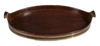 A George III mahogany and brass banded oval tray, late 18th century  A George III mahogany and brass