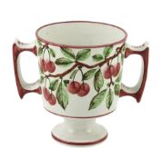 A Wemyss two-handled loving cup, circa 1900, painted with branches on cherries  A Wemyss two-handled