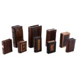 Eight puzzle-opening book boxes, mainly 19th century  Eight puzzle-opening book boxes,   mainly 19th