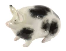 A small Wemyss black and white piglet, circa 1900, impressed 'WEMYYS WARE R  A small Wemyss black