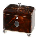 A late George III tortoiseshell veneered and ivory banded tea caddy, circa 1800  A late George III