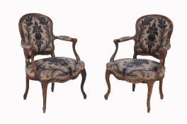 A pair of walnut fauteuils in the Louis XV style, second half 19th century  A pair of walnut