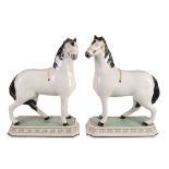 A pair of modern Staffordshire pottery reproductions of early 19th century...  A pair of modern