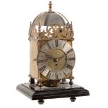 A gilt brass spring-driven quarter-chiming lantern mantel clock The frame...