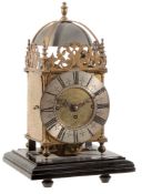A gilt brass spring-driven quarter-chiming lantern mantel clock The frame...