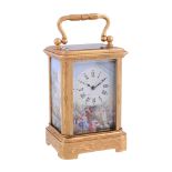 A French engraved gilt brass miniature carriage timepiece with painted...