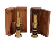 Two similar Victorian lacquered brass field microscopes Both unsigned
