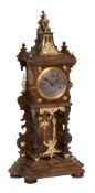 A German gilt metal mounted walnut 'swinging cherub' mantel timepiece Lenzkirch