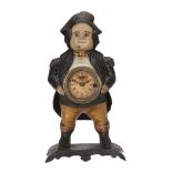An American polychrome painted cast iron figural blinking eye mantel timepiece