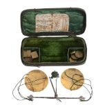 A George I cased set of cut steel and brass portable coin scales Timothy...
