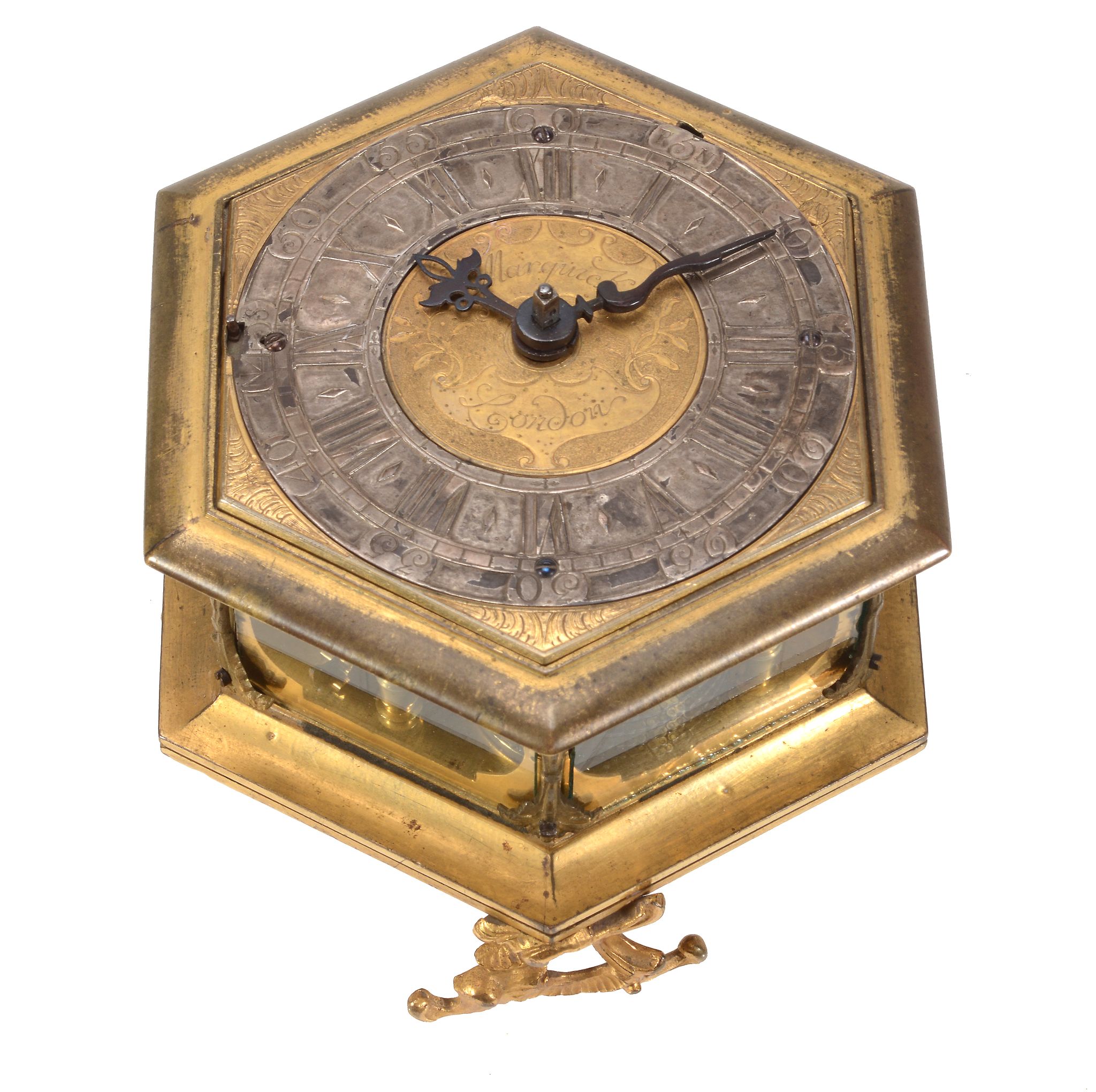 A fine Germanic gilt brass hexagonal horizontal striking table clock Signed...