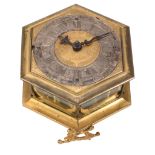 A fine Germanic gilt brass hexagonal horizontal striking table clock Signed...