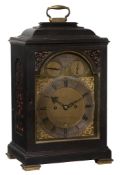 A fine William IV ebonised table clock with original numbered winding key...