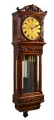 A fine Victorian carved figured walnut quarter-chiming wall regulator Reid...