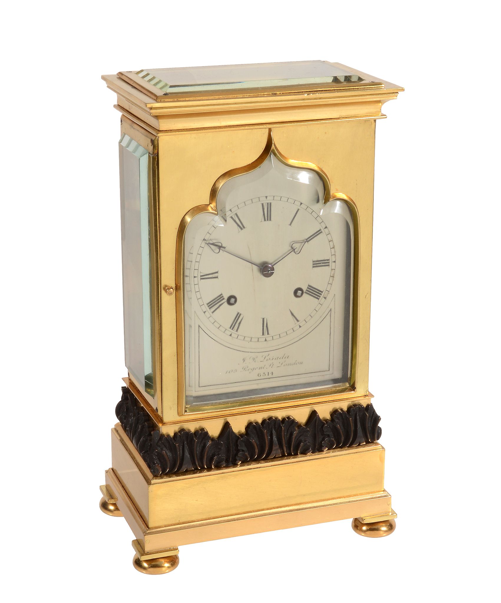 An early Victorian small gilt and patinated brass four-glass mantel clock...