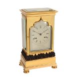 An early Victorian small gilt and patinated brass four-glass mantel clock...