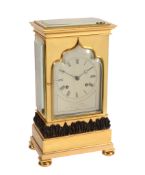 An early Victorian small gilt and patinated brass four-glass mantel clock...