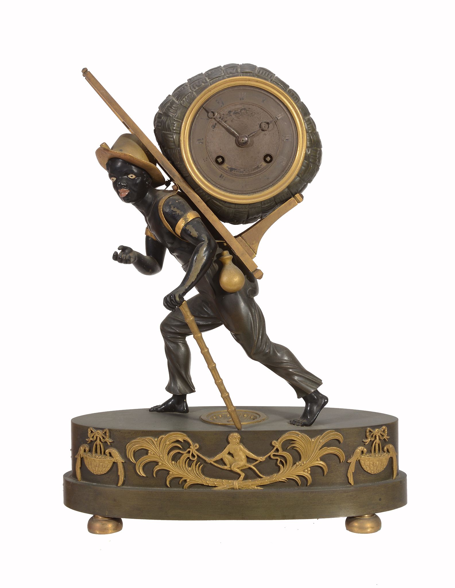 A rare French Empire ormolu and patinated bronze figural mantel clock