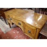 A George III mahogany sideboard, circa 1800, with shallow central bowfront 143cm wide