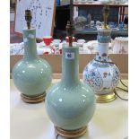 A pair of celadon baluster lamps and another modern Chinese lamp decorated in famille verte