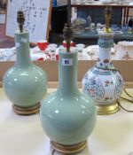 A pair of celadon baluster lamps and another modern Chinese lamp decorated in famille verte