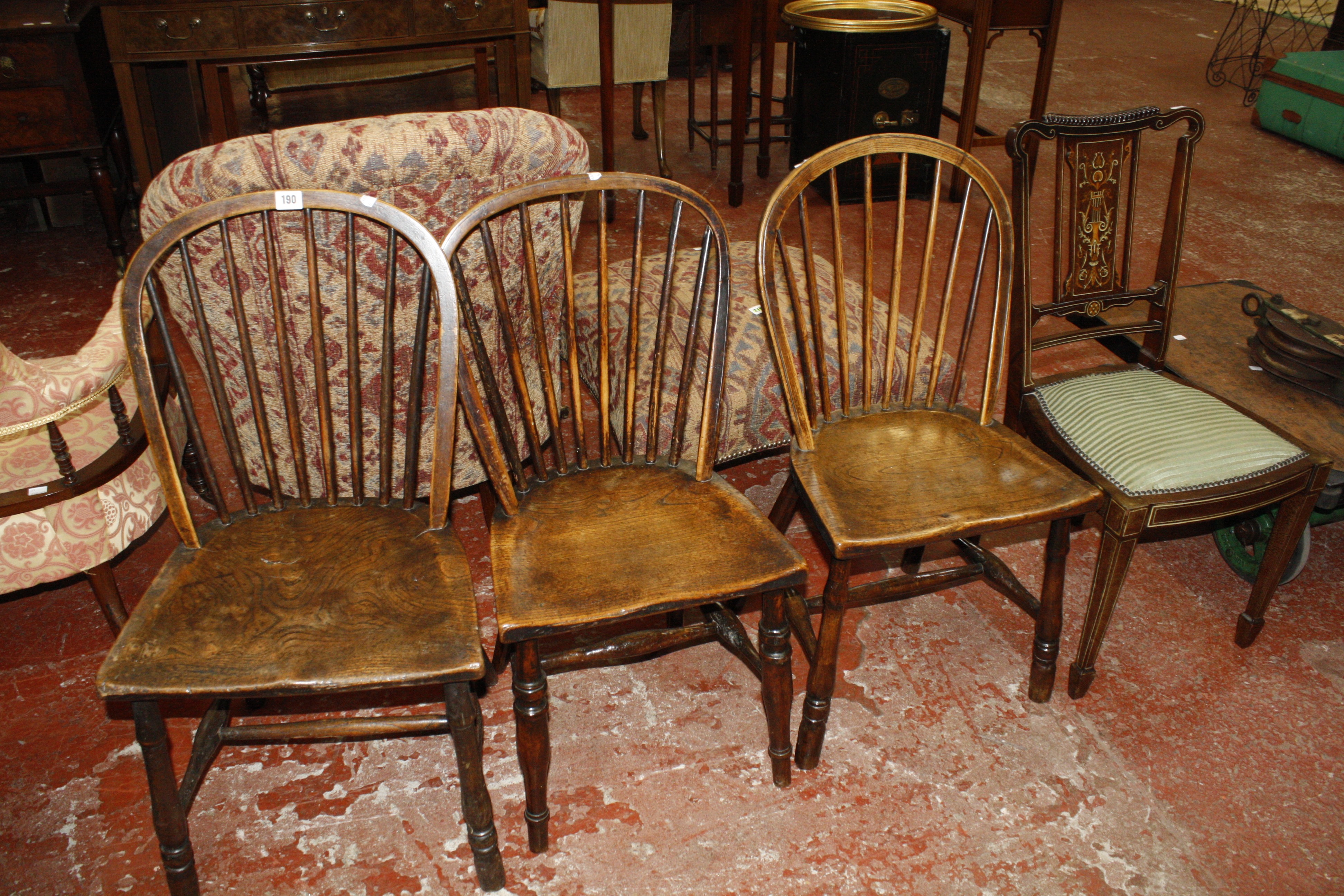 An Edwardian side chair, a Mahogany chair nursing chair and three spindleback chairs.