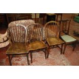 An Edwardian side chair, a Mahogany chair nursing chair and three spindleback chairs.