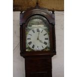 A 19th Century Mahogany longcase clock with Fox Hunting scenes to the face. 216cm high.