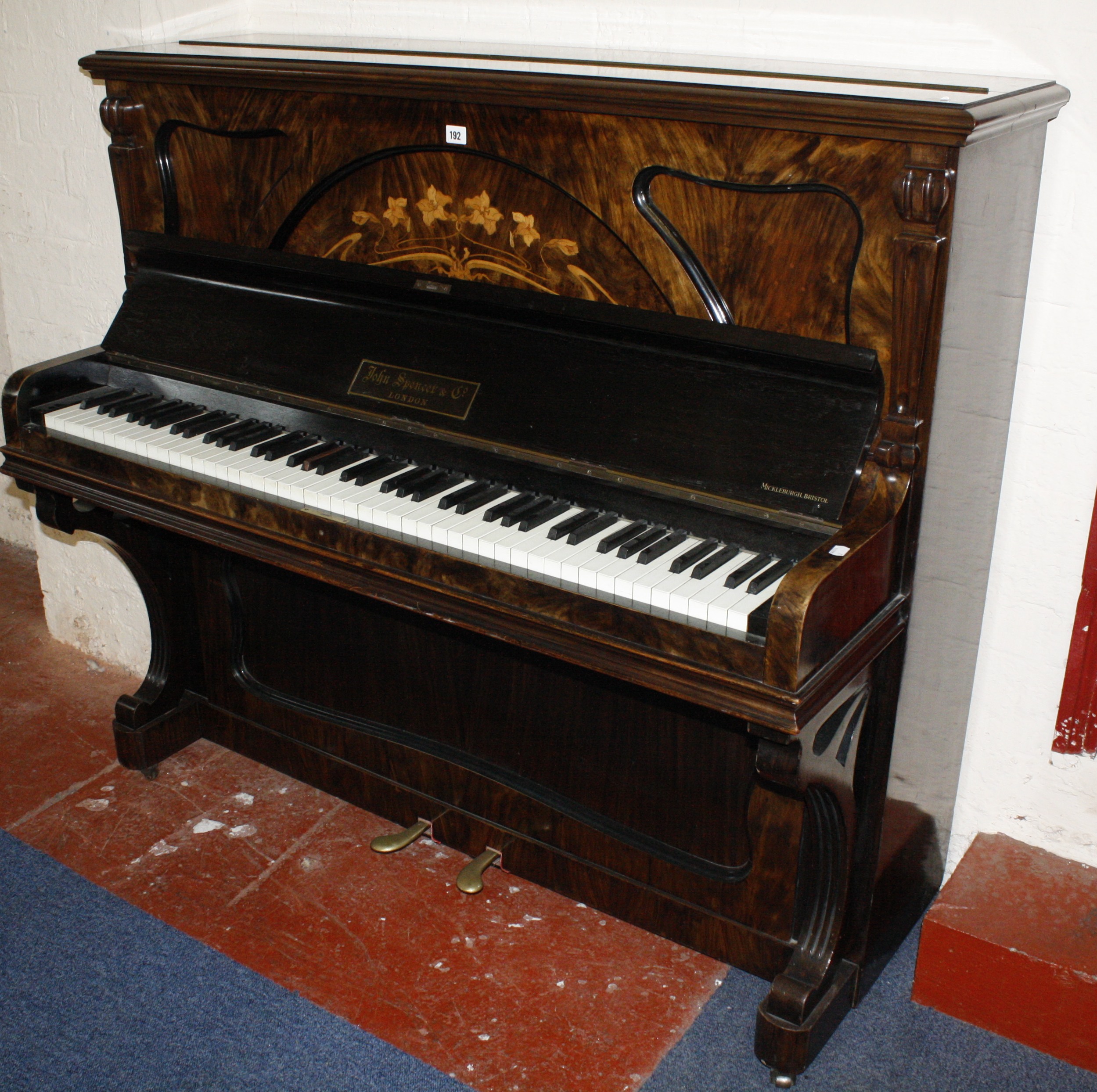 A walnut upright piano by John Spencer, London