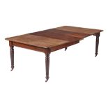 A late Victorian mahogany dining table, circa 1890, made by Selbat, with two extra leaves, the top