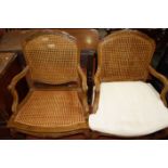 A pair of Louis XV style cane fauteuil. (one cushion).