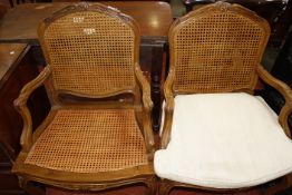 A pair of Louis XV style cane fauteuil. (one cushion).