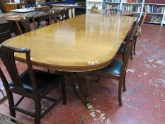 A two piece Regency style mahogany dining / boardroom table raised on two swept pedestals. 306cm x