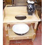 A Victorian pine washstand, with a jug and a bowl.