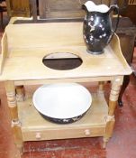 A Victorian pine washstand, with a jug and a bowl.