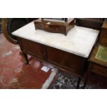 An Edwardian marble top mahogany washstand. 115cm wide and a mid 20th century two seat sofa,