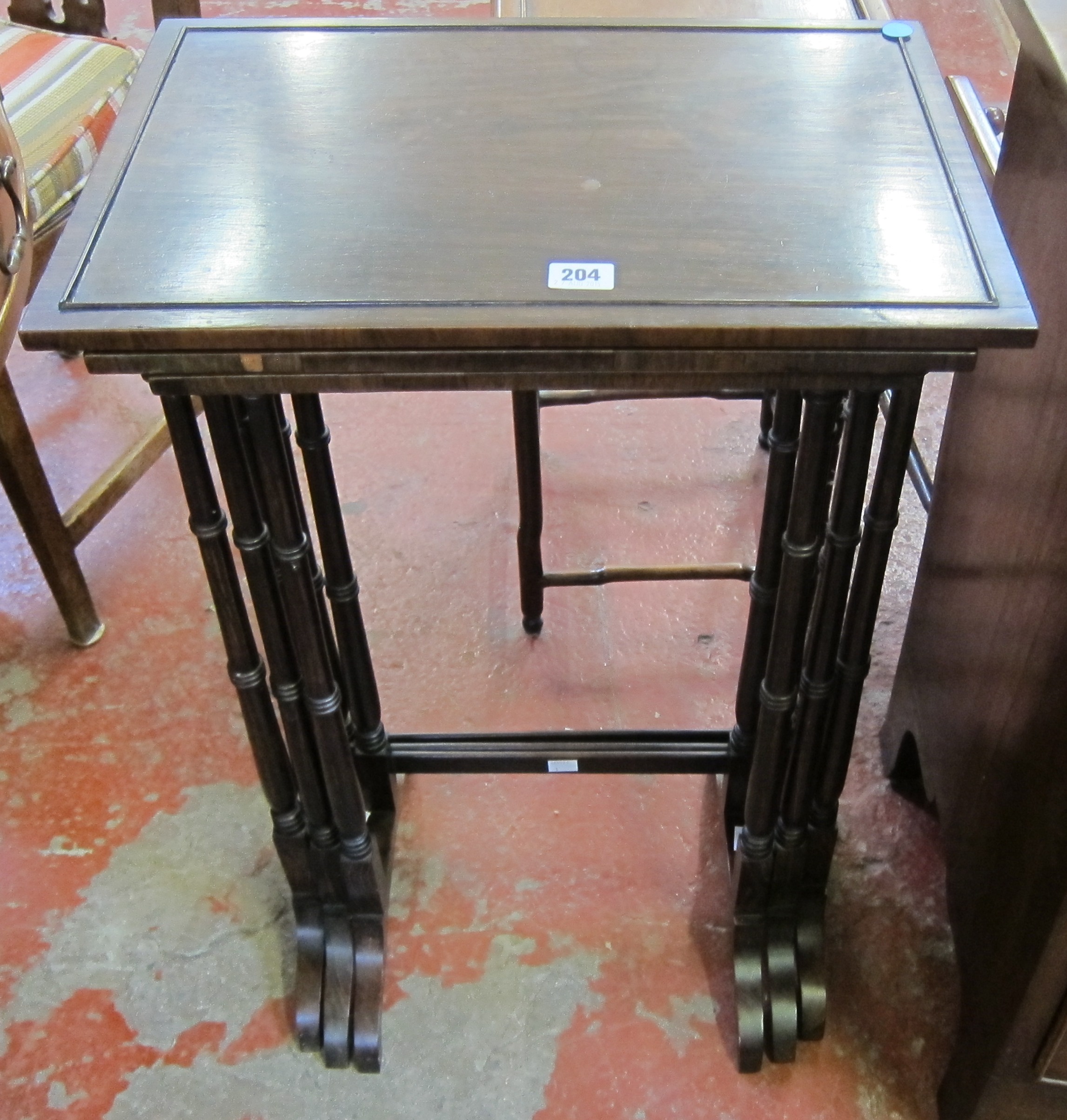 A 19th century rosewood nest of three tables.