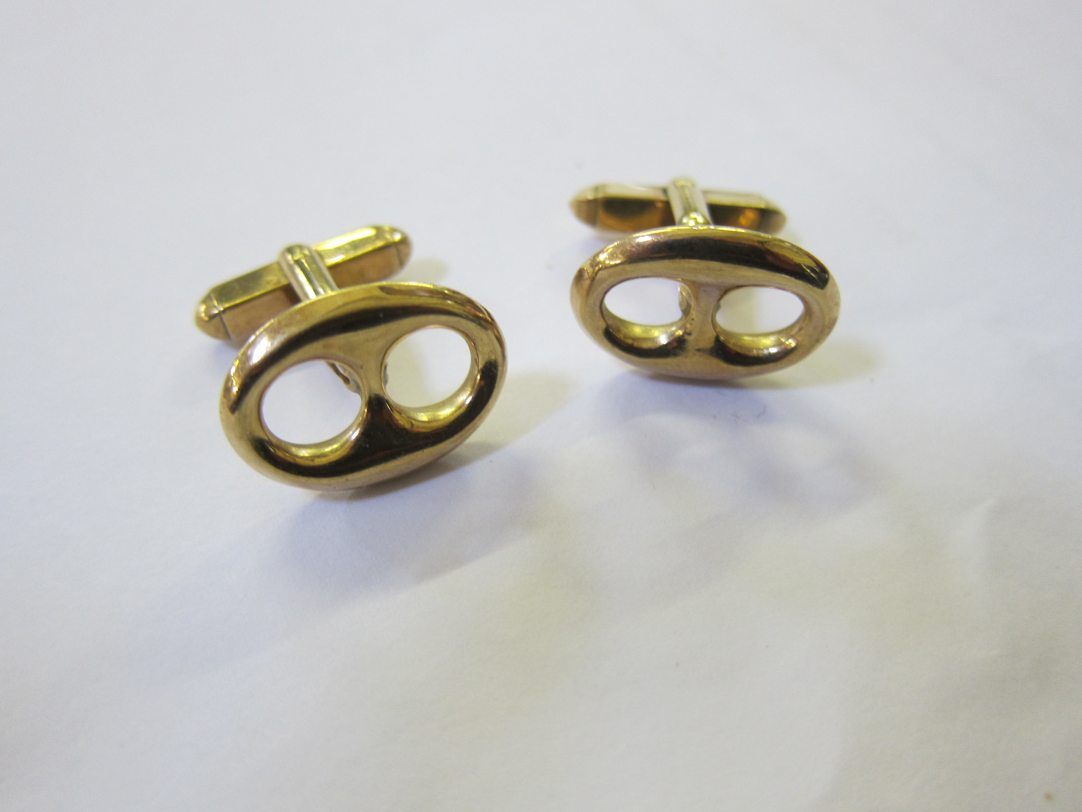 A pair of 9ct gold cufflinks marked Gucci, 14g approx.