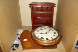 An oak drop dial wall clock, B.R.W. and a mahogany small table chest of drawers (2)